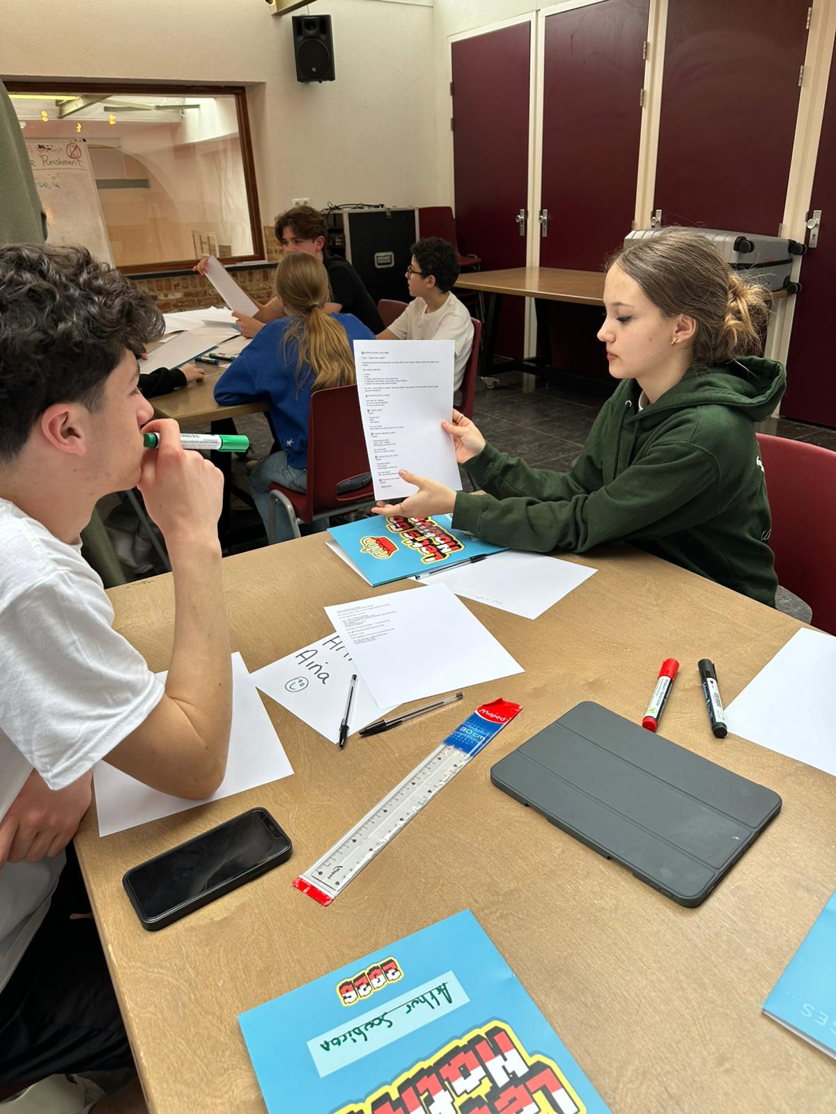 Students working on Make Your Own Country — worksheets, markers, discussion