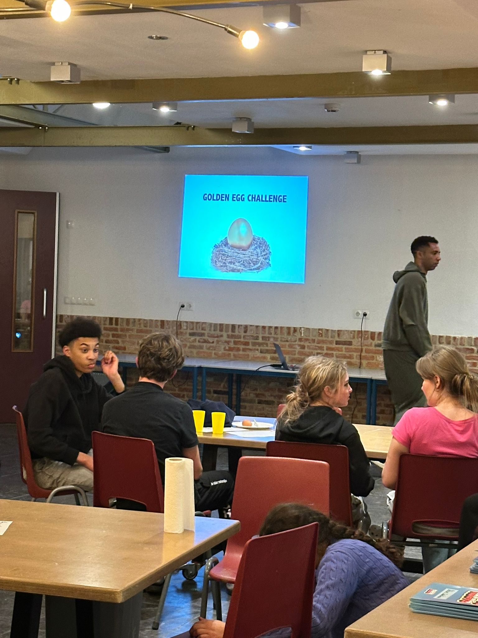 Egg drop construction phase — students building protective structures